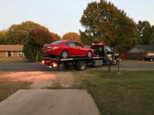 Tow Truck Backing Up Into Driveway.