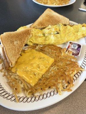 The usual bacon and cheese omelette, hash browns and white toast