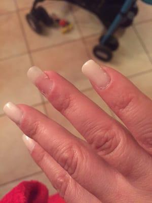 Gel nails. Tip lifted off not even 24 hours later. Nail polish lifted off due to the five layers of clear coat THE OWNER put on.