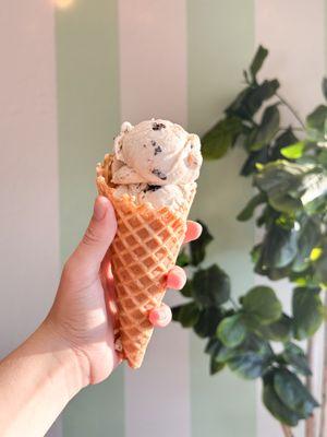 Small batch ice cream made in Phoenix, Oregon. Cookies & Cream in a fresh baked waffle cone.