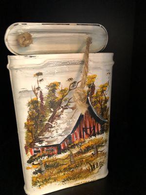 Hand painted tobacco tin.