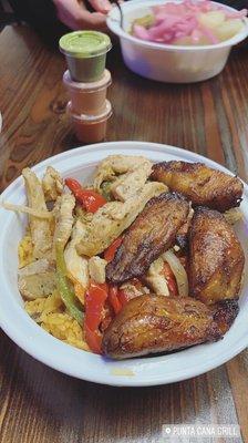 chicken and peppers over rice and beans with sweet plantains