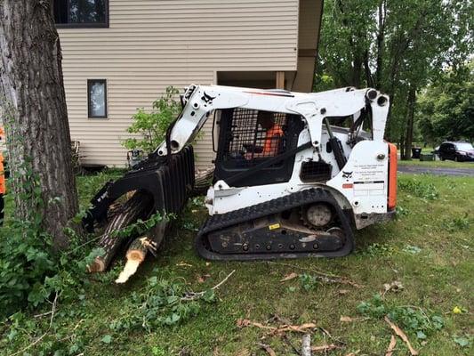 Our bobcat with caterpillar treads minimizes damage to lawns.