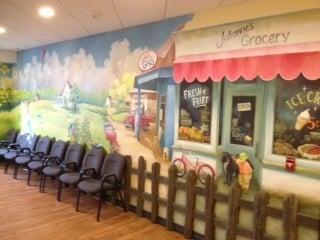 Our kid friendly décor has an old town mural to match our Club House.