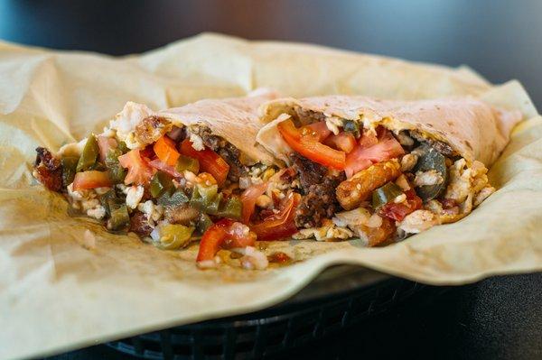 Our Monster Breakfast Burrito! If you like Jalapenos, Tomatos onions, Hash Browns and and your choice of Ham,  Bacon or sausage