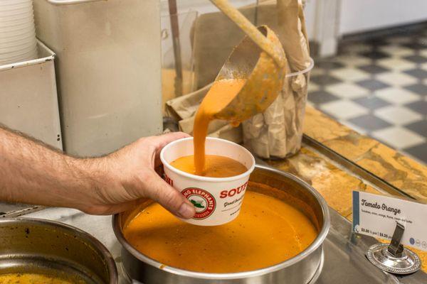 Enjoy a cup of our famous tomato orange soup!