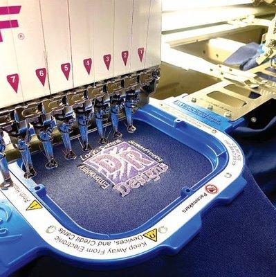 At D R Designs, we specialize in custom embroidery. screen printing and logo creation.