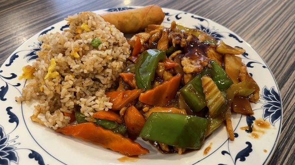 Sichuan Spicy chicken lunch special with fried rice and an egg roll.