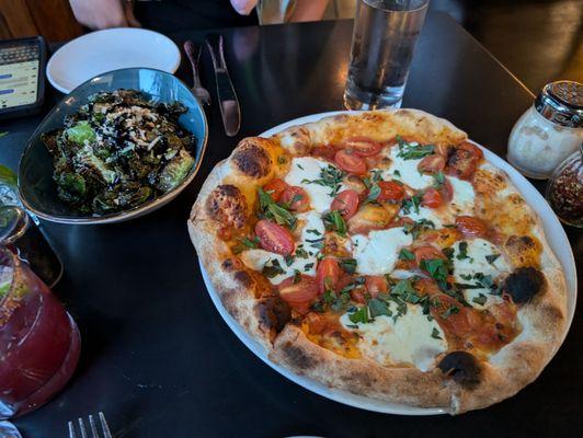 Margarita pizza and brussel sprouts with balsamic and pecorino