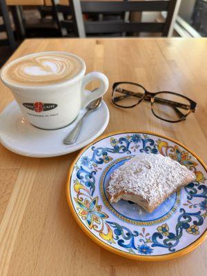 Incredible latte and dreamy pastry.  It's cold right next to the register.  This place is an Italian wonderland.