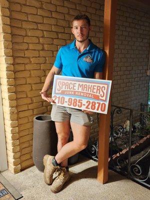 Model team member and sign! Call us today for your junk removal needs!