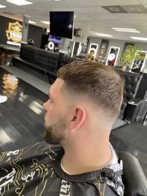 Mid fade with blended beard