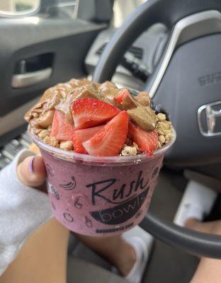 bowl with gronola, strawberry, banana, almond butter, blueberry's