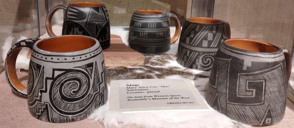 Mugs by Mac Schweitzer (1921-1962).  "Ceramic, glazed.  On loan from Western Spirit: Scottsdale's Museum of the West."