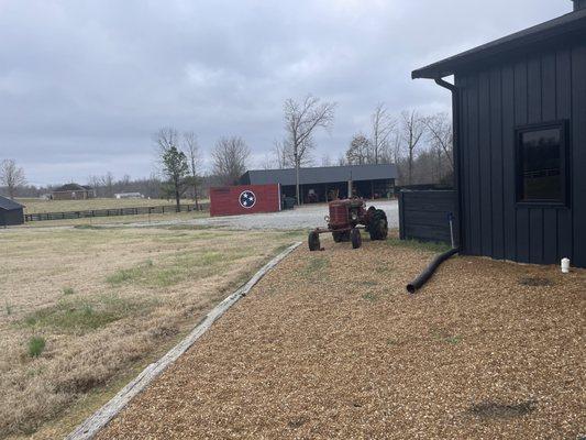 Tractor on the side of the distillery.