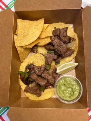 Beef Fajita tacos with chips, lime, and avocado!