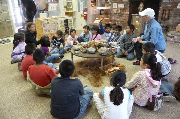 Nature Center Docent leading a school group activity.