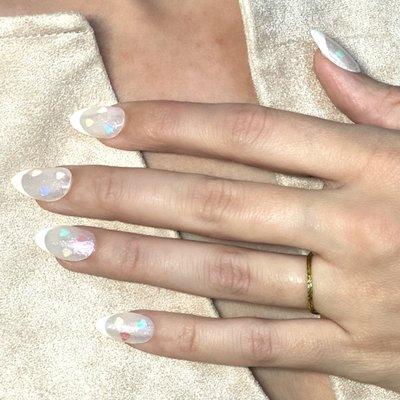 GelX extensions in short round w full bling nail art