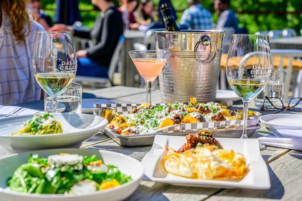 Spring Market Salad, Harissa Grilled Octopus, House Made Spaghetti, Smoked Brisket Nachos, Wine and Cocktails