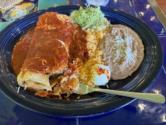 Chimichanga with enchilada red sauce filled with shredded beef and rice n refried beans and guacamole and sour cream. Awesome!!!