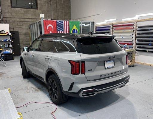 After! :) Black roof wrap and blacked out emblems (KIA, Sorento, AWD) previously silver.