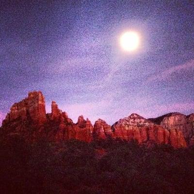 Full moon over red rocks