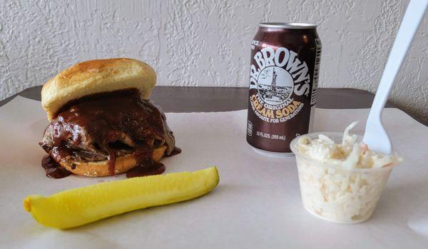 Bbq brisket sandwich and slaw and soda, $16 total