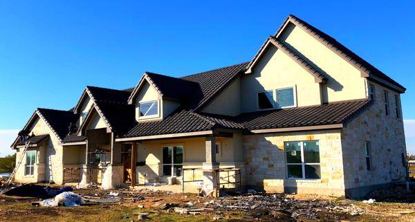 December 2017. Barrel tile install new construction on custom home build.