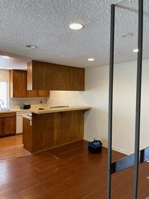 Painted dining area and kitchen! Notice how they painted the small slits between the tile and cabinets!