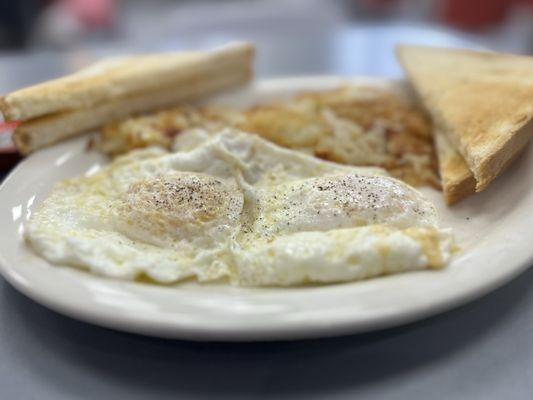 Eggs hashbrowns and white toast