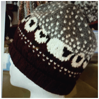 Knitted hat featuring sheep