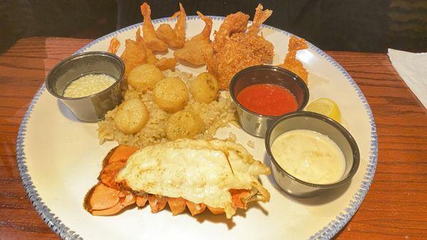 Ultimate feast lobster, shrimp scallops and shrimp.