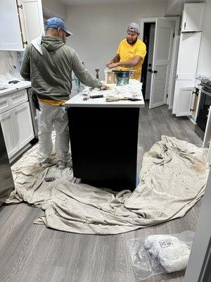 Workers finalizing my cabinets