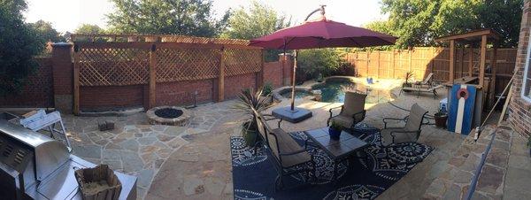 After gas fireplace, extended flagstone patio, and trellis