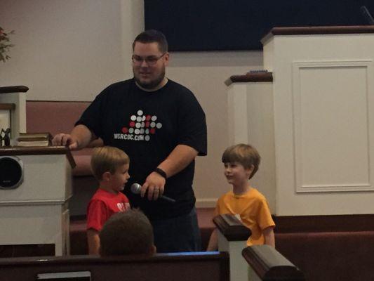 Young boys are encouraged to lead songs during Family Bible Time.