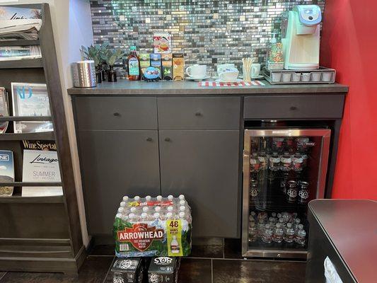 Waiting area with fully stocked drinks