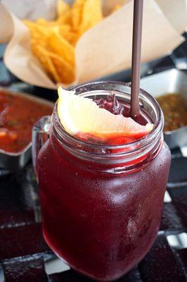 Red Sangria: freshly squeeze marinated fruits & red wine ($8).