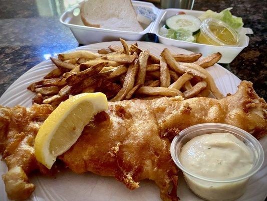 Beer battered fish dinner with French fries and salad