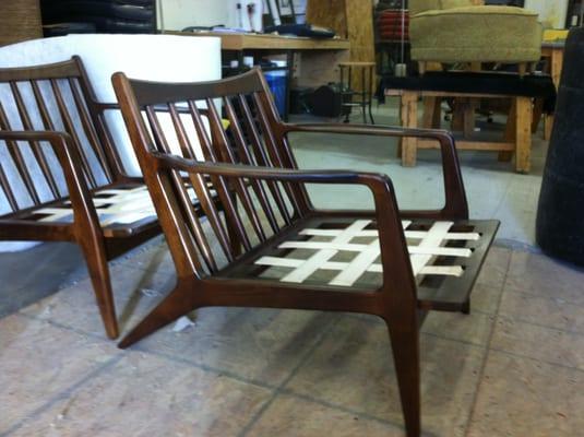 Contemporary chair with the wood finish redone and seat webbing replaced