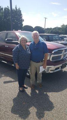 My wife and I standing in front of our 2018 Ram truck on the day we picked it up.