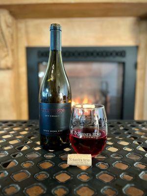 Cozy up to the fire in our Tasting Room Lounge and a bottle of our elegant Cinsault.