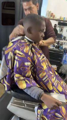 The barber putting his magic touch to my son's hair lol