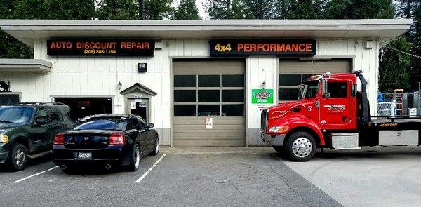 Auto Discount Repair & Towing's dual bay shop and tow truck.