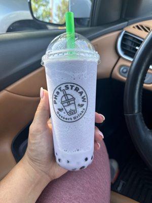 Large Taro blended milk tea (green tea) and boba.