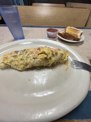 I love the Mexican Omelette! It does come with your choice of Hash Browns or American fries.