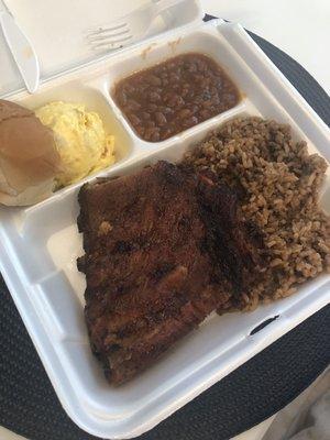 BBQ ribs, potato salad, and beans.