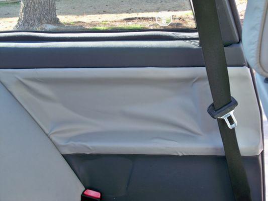 Rear door card with peeling upholstery