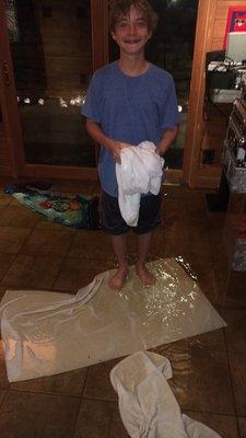 My kiddo cleaning up after one of the floods.