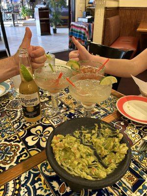 Drinks, guacamole, and 2 thumbs up for a great dinner.