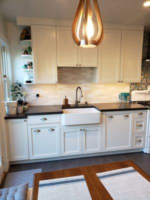 Love our farmhouse sink. Mike's tile work on the backslash and floor is impeccable.  I think he's happiest when tiling.